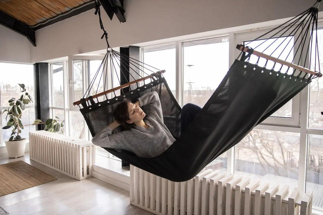 Woman sleeping in a hammock