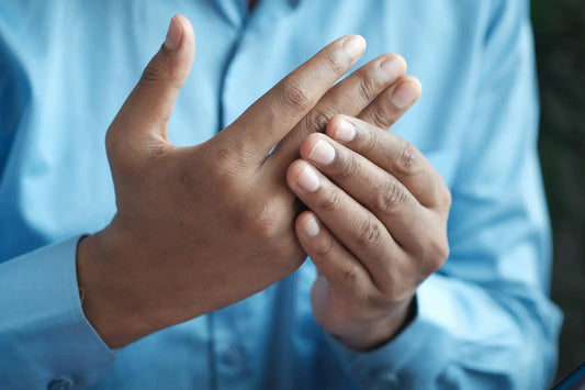 A person rubbing CBD on their wrist