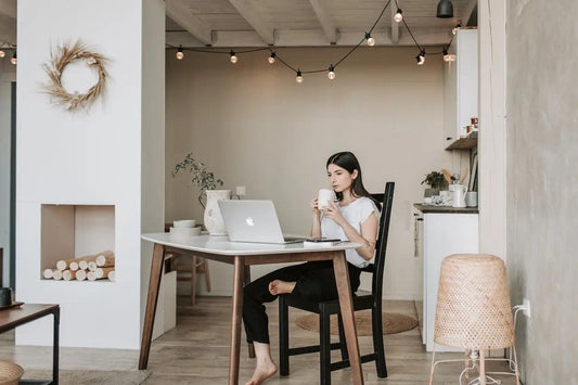 A focused young woman reading emails