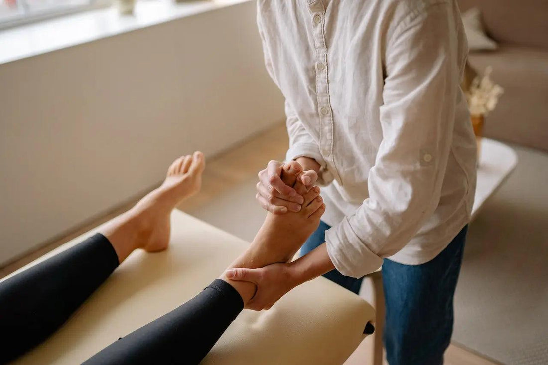 a woman getting a foot massage with CBD rub